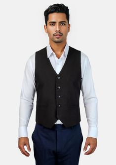 This Midnight Black Vest is designed with stretch cotton for comfort in classic black that is timeless in style. Level up your two piece black stretch suit with this custom made vest for a three piece look that is sure to impress. Classic Black Vest For Business, Fitted Black Suit With Vest, Black Sleeveless Suit With Vest, Black Fitted Vest For Semi-formal Occasions, Black Suits With Vest For Formal Occasions, Tailored Black Suit For Office Wear, Elegant Black Slim Fit Vest, Fitted Black Cotton Blazer, Classic Black Suits With Vest