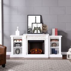 a living room with a white fireplace and grey walls