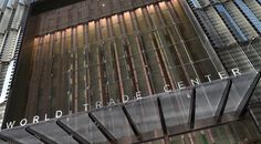 the world trade center building in new york city, ny is reflected in its glass facade