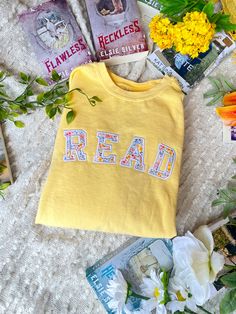 This comfy crew is perfect for spring! it features a pastel yellow Crewneck with a READ applique design using the perfect spring fabric! These sweatshirt are unisex sizing. I recommend going a size up for an oversized fit. The yellow Crewneck is Comfort Colors brand. The rest of the Crewneck option are Gildan.