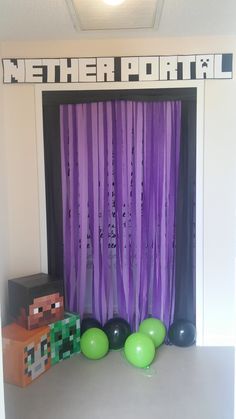 a room with purple curtains and balloons in front of the door that says minecraft