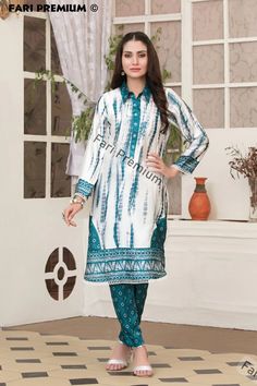 Last Dress in Large 46" Bust Round   Free Shipping  BRAND NEW Stitched, Ready-Made Embellished, Tie & Dye Printed  2-Piece Silk Shalwar Kameez 2 Piece Suit  READY-MADE / STITCHED / READY TO WEAR Two Piece Includes: 1. Shirt: Full-sleeve silk kameez/shirt with printed tie & dye design on front. Shirt has a beautiful collar neck open design halfway down with pearl & stone buttons and a lace designed on bottom half. White Hoop Lace designed on front and back of daaman and sleeve cuffs. 2. Shalwar/Bottom: Silk Shalwar with a full tie & dye design print on entire shalwar. Color(s): Ocean-Blue, White Clothing Type(s): Kurti/Kameez, Shalwar/Trouser Available in Size:  👗 Large 46 Bust-Round Measurements: Large 46" Size Shirt/Kameez:  ✮ Bust-Round: 46.5" ✮ Waist-Round: 44.5" ✮ Hip-Round: 50" ✮ Len Fitted Churidar With Printed Motifs For Festivals, Fitted Churidar With Printed Motifs For Diwali, Fitted Churidar With Printed Motifs For Transitional Season, White Bandhani Print Semi-stitched Kurta, Fitted Mulmul Churidar With Printed Motifs, Fitted Churidar With Printed Motifs For Navratri, Fitted Bandhani Print Churidar For Transitional Season, Fitted Mulmul Unstitched Suit With Dabka, Transitional Season Fitted Bandhani Print Churidar