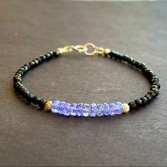 Gemstone: 4mm Natural Tanzanite & 3mm Black Spinel Faceted Natural Crystal Beads Metal: All Metal Used Is Sterling Silver Length: 7” Inches ( Custom Length Is Available) Tanzanite Is December Birthstone Tanzanite Bracelet, Lucite Bracelets, Message Necklace, 18k Gold Bracelet, Bracelets Handmade Diy, Beaded Jewelry Designs, Beading Ideas, Sterling Silver Jewelry Handmade, Coral And Gold