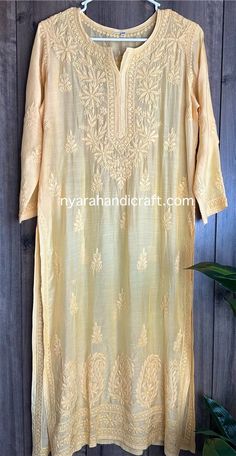 Elegant and soft pure muslin pale yellow kurta with liner, paired with a pure linen printed dupatta.  Stylish and Summery !! Kurti length : 46 inches  Liner included Traditional Yellow Kurta With Naqshi, Beige Chikankari Embroidered Kurta For Festivals, Beige Chikankari Embroidery Kurta For Festivals, Festive Beige Chikankari Embroidered Kurta, Yellow Straight Kurta With Naqshi, Traditional Yellow Naqshi Kurta, Yellow Chikankari Embroidered Chanderi Dupatta, Yellow Lucknowi Kurta, Yellow Chanderi Kurta With Naqshi Detail