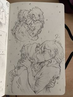 a drawing of two people kissing in front of an open book with writing on it