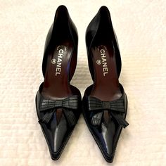 Vintage Chanel Shoes 3”Heels Amazingly Great Condition Chanel Black Leather Pumps With Cutouts On Each Side. Tone-On-Tone Stitching. Fringed Bow With Cc Logo. Burgundy Leather Soles. Excellent Condition Chanel Bow Pumps, Bow Pumps, Black Leather Pumps, Shoes Vintage, Leather Bow, Leather Bows, Chanel Black, Cc Logo, Chanel Shoes