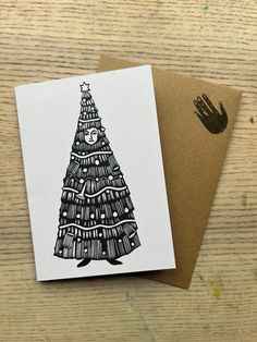 a card with a drawing of a christmas tree on it