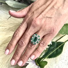 This One-of-a-Kind, Custom-Made Natural Emerald and Diamond Ring is a luxurious piece designed to captivate. Crafted in 14k gold, it showcases a finely faceted, high-quality natural emerald as the center stone, radiating deep green elegance and sophistication. The emerald is complemented by a stunning arrangement of brilliant diamonds that enhance its color and sparkle. Sized at 6.5 and resizable for a perfect fit, the ring has an impressive total carat weight (TCW) of 4.52 carats. Certified and Platinum Oval Emerald Ring With 17 Jewels, Oval Platinum Emerald Ring With 17 Jewels, Luxury Green Sapphire Ring Gia Certified, Green Gia Certified Sapphire Ring, Green Gia Certified Luxury Sapphire Ring, Fine Jewelry Emerald Ring With Cluster Shape In Platinum, Fine Jewelry Platinum Emerald Cluster Ring, Fine Jewelry Platinum Cluster Emerald Ring, Luxury Green Gemstones With Halo Setting