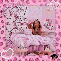 a woman laying on top of a bed in a pink room with hello kitty wallpaper