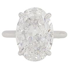 an oval diamond ring with three pear shaped diamonds