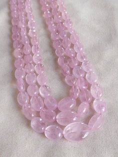 Pink Morganite Smooth Nuggets Pebble Beads Necklace Pink Beryl Tumbled gemstones Handmade Necklace Natural Morganite Pink Shade Natural Morganite Uneven shape Nuggets or Tumbled Gemstones or pebble Beads. We will make Necklace with single, double or 3 line GENUINE : 100% Natural :Natural Gemstones Size : Approx 8 - 18 mm stones as Length & 6 - 12 mm as Width Strand Length : 16 inches Each Strand Weight : 160 - 180 carat (16 inches Stone strand) Country/Region of Manufacture : India I am Flex Luxury Traditional Pink Beaded Necklaces, Cheap Pink Jewelry With Faceted Beads, Natural Stone Oval Beads For Jewelry Making, Natural Oval Beads Gemstones For Jewelry Making, Tumbled Gemstone Beads For Jewelry Making, Three Strand Necklace, Beads Jewellery, Pink Shade, Pink Morganite