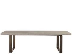 a white table with metal legs and a rectangular top, on a white background in front of a wall