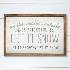 a wooden sign that says, oh the weather outside is fightful let it snow