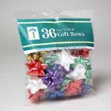 a bag of assorted colored bows on a white background