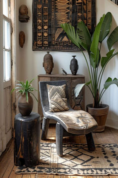 A corner of a room showcasing Afrobohemian decor with tribal art and lush green plants. Global Home Decor Style, African Furniture, Ethnic Decor