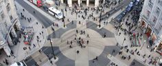 an aerial view of people walking on the street