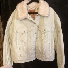 Gorgeous Light Green Levi’s Cropped Corduroy Jacket. Nwt’s, Snap Closure With Two Chest Pockets And Two Waist Pockets. Faux Fur Collar And A Comfy Quilted Lining. Size 1x, Pit To Pit 27”, Length 24”. 100% Cotton. Msrp $109.00 White Outerwear With Corduroy Collar And Long Sleeve, White Long Sleeve Outerwear With Corduroy Collar, Spring Denim Jacket With Corduroy Collar, Long Sleeve Denim Jacket With Corduroy Collar For Spring, Cold Weather Cotton Denim Jacket, Trendy Winter White Cotton Outerwear, Levi's White Spring Outerwear, Levi's White Outerwear For Spring, Levi's Collared Spring Outerwear