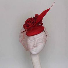 A rich red silk pillbox with  beautiful silk flowers,  shaped feather and red veiling. 14 cms diameter fine for Royal Ascot Royal Enclosure Secured by hat elastic which is easily hidden. This fascinator can be made in other colours. Please allow 7 days for this item to be made Fascinator Hats Outfit, Mother Of The Bride Hats, Green Fascinator, Red Fascinator, Kentucky Derby Fascinator, Bridal Fascinator, Derby Fascinator, Pretty Hats, Sinamay Hats