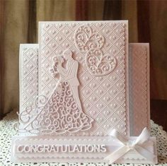 wedding congratulations card with bride and groom silhouettes on the front, handmade in white