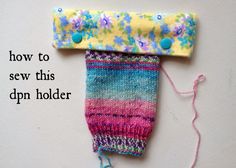 a colorful knitted object with the words how to sew this dpn holder