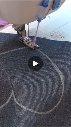 a video demonstrating how to use a sewing machine for stitching and embroding