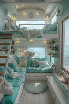 a bedroom with bunk beds and blue pillows on the bed, next to a window