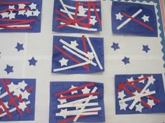 six red, white and blue napkins are arranged on a sheet of paper with stars