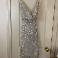 Silver Sequin Dress, Fashion Nova Size Small, New With Tags. Slit In Side, Crisscross In Back Straps, Straps Are Elastic. Very Stretchy Material, Little Itchy Around The Bottom When The Liner Doesn’t Meet The End Of Sequin Fabric. Fashion Nova Black Dress, Dresses Silver, Slinky Mini Dress, Glitter Mini Dress, Silver Sequin Dress, White Bodycon Dress, Spaghetti Strap Mini Dress, Ribbed Mini Dress, Black Knit Sweater