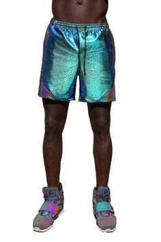 man wearing green rave shorts from Love Khaos Metallic Stretch Disco Shorts, Metallic Disco Shorts For Summer, Metallic Rave Bottoms For Summer, Summer Rave Metallic Bottoms, Rainy Festival Outfit, Neon Rave Outfits, Beach Festival Outfit, Winter Rave Outfits, Rave Shorts