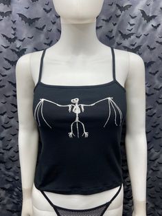 This is a black sleeveless Bat skeleton cropped tank top. This has a Bat image screen printed on the front in white ink. 57% cotton/ 38% polyester/ 5% Spandex These are handmade screenprinted and slightly vary from the photo. Please feel free to email me any questions. Thanks for looking. The seller is not responsible for any lost or stolen packages.