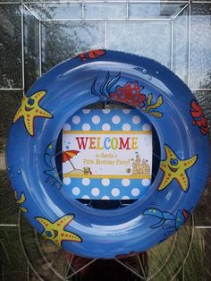 an image of a blue swimming ring with the words welcome to our party on it