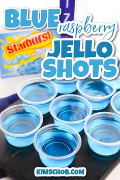 blue raspberry jello shots are arranged on a tray with the words, standup berry jello shots