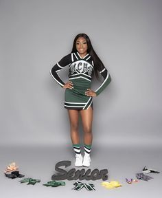 a woman in a cheer uniform standing next to letters that spell out the word seloa