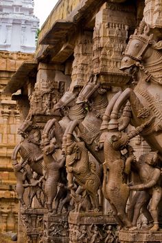 an intricately carved sculpture on the side of a building