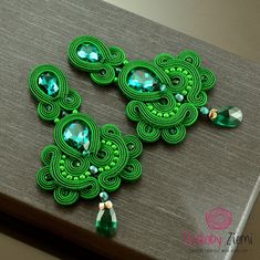 Long green chandelier soutache earrings unique sparkling earrings crystal greenery earrings long emerald glossy orecchini soutache elegant FAST SHIPPING - order is delivered to you by COURIER SHIPMENT (phone number required)! Beautifully shining on the ear, they add a very special charm of each styling. Only with these glossy elegant earrings your New Year's styling will be complete. They were made for classy women who like to emphasize beauty and appreciate originality and uniqueness. Thus ador Green Handmade Earrings For Evening, Green Chandelier, Beach Craft, Green Chandeliers, Shibori Jewelry, Dance Belt, Soutache Necklace, Africa Dress, Indian Jewellery Design Earrings