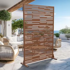 an outdoor living area with wicker furniture and large wooden slatted screen on the wall