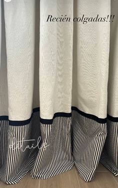 three black and white striped curtains with the words receit colgadas on them