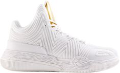 the nike zoom basketball shoe is white with gold accents on the upper part of the shoe