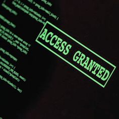 a green sticker on the side of a computer screen that says access granted