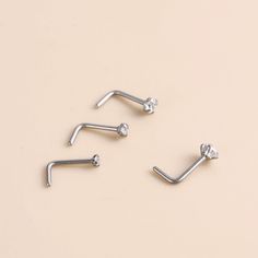 Buying Option: - $6.88 for Single Piece- $12 for a 2 pieces (you can choose 2 different nose rings)*Comment your option of patterns and color on "Personalization"----------- DESCRIPTIONS ------------ Color: Silver- CZ Size: 1.5mm / 2mm / 2.5mm / 3mm- Materials: G23 Titanium, Cubic Zirconia- SKU: HSPJ532----------- MIX MATCH PURCHASE -----------We do offer mix-match purchases for different listings at the same price, please provide your desired SKU & pattern in the personalization column. Silver Hypoallergenic Round Nose Studs, Hypoallergenic Silver Round Nose Studs, Mismatched Earrings Studs, Initial Jewelry Necklace, Piercing Stud, Nose Piercing Stud, Piercing Nose, Presents For Best Friends, Daughter Mother