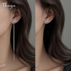 Experience the unique design of Thaya's Silver Cross-shaped Earrings for Women. Made from high-quality 925 silver metal material and designed with a stunning cross pattern, these earrings are both elegant and sophisticated. With a focus on female gender and an overall length of about 12cm and cross size of 10*17mm, they are perfect for any occasion. Elevate your style with Thaya's stunning Silver Cross-shaped Earrings. Elegant Hypoallergenic Cross-shaped Earrings, Elegant Hypoallergenic Cross Earrings, White Gold Cross Earrings For Pierced Ears, Elegant Pierced Cross Jewelry, Elegant Pierced Cross Earrings, Minimalist Silver Cross Earrings, Silver Tassel Earrings, Cross Patterns, Silver Cross