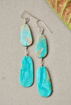 Native American double slab earring by artist Ronald Chavez Beautiful turquoise earrings with double slab. Gorgeous blue tones and soft matrix. Great pair of earrings by the talented Santo Domingo artist Ronald Chavez. Measurements : top slab : 1" X 0.5" bottom slab : 1 3/8" X 5/8" total length : 2 13/16" sterling silver turquoise Artsy Turquoise Nickel-free Jewelry, Artistic Turquoise Jewelry With Matching Earrings, Artsy Turquoise Nickel-free Earrings, Artsy Nickel-free Turquoise Earrings, Native American Jewelry, Blue Tones, Turquoise Earrings, Silver Turquoise, Turquoise Sterling Silver