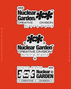 three stickers with the words nuclear garden and creative division on them, all in black and white