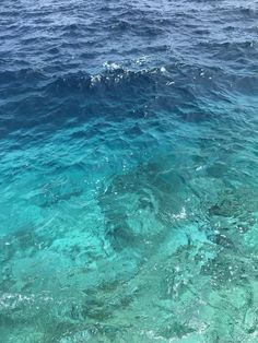 the water is very clear and blue with some waves coming up on it's surface