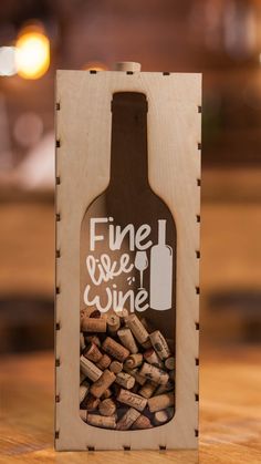 a wine bottle shaped box filled with corks