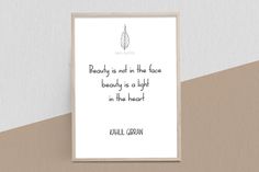 a framed print with a quote about beauty is not in the face, but in the light