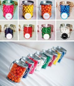 there are many different jars with candy in them