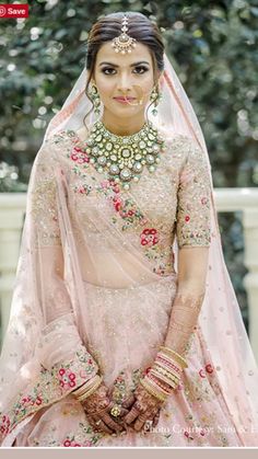 a woman in a pink bridal outfit