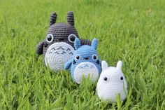 three crocheted stuffed animals sitting on top of green grass with the words digital download above them