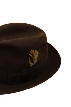 Classic and timeless! This gorgeous vintage chocolate brown suede hat from the 50s is perfect for your commute, Don Draper. The black hat band holds a vintage feather for a little flare! Sized as "extra long oval". Union Made. Product Measurement Details: Length: 11" Width: 10" Height: 5" Brim: 2" Head Length: 8" Head Width: 6.5" Damage to consider: See images in carousel of any damage. Condition: A See the Condition Grade Scale on the photo carousel. Care: Suede brush and professional cleaning. Formal Brown Brimmed Top Hat, Formal Brown Top Hat For Fall, Classic Brown Hat Bands For Kentucky Derby, Classic Brown Felt Hat With High Crown, Classic Brown High Crown Felt Hat, Formal Brown Fur Felt Top Hat, Brown Fur Felt Top Hat For Formal Occasions, Formal Brown Felt Hat With Short Brim, Classic Brown Top Hat For Formal Occasions